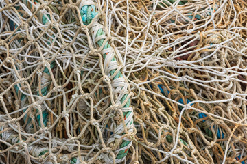Close up of a detail of a fishing net in the harbor 