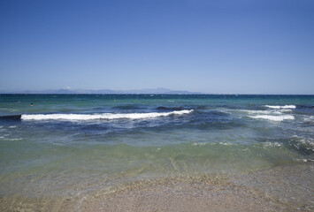 Fototapeta na wymiar sea horizontal landscape with waves in Greece in summer