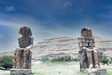 The Colossi of Memnon are two massive stone statues of the Pharaoh Amenhotep III, who reigned in Egypt during the Eighteenth Dynasty of Egypt. 