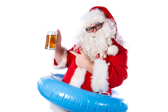 Funny santa claus drinks beer.