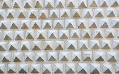 Patterned grey wall decorated with sgraffito ornamentation in Segovia, Spain