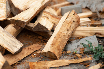 Stacks of firewood. A pile of firewood. Firewood background. A pile of stacked firewood, prepared for heating the house.