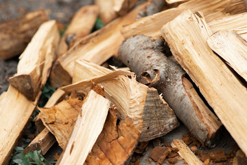 Stacks of firewood. A pile of firewood. Firewood background. Gathering fire wood for winter or bonfire.