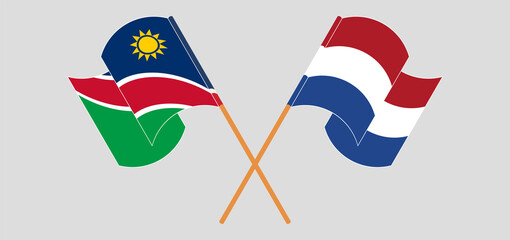 Crossed and waving flags of Namibia and the Netherlands