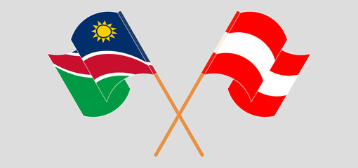Crossed and waving flags of Namibia and Austria