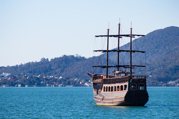 pirate ship in the blue sea in a sunny day in Florianópolis, Santa Catarina, Brazil