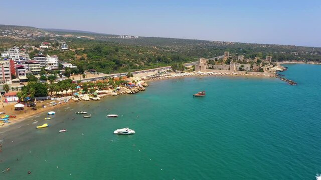Kızkalesi is a town in Mersin Province, Turkey. The town, known in Antiquity as Corycus or Korykos, is named after the ancient castle built on a small island just facing the town.