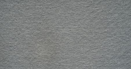 The texture of a gray felt fabric of a rectangular shape, a place for text