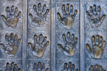 Metal open hands in sculpture in the Plaza de la Catedral de Leon. Spain 