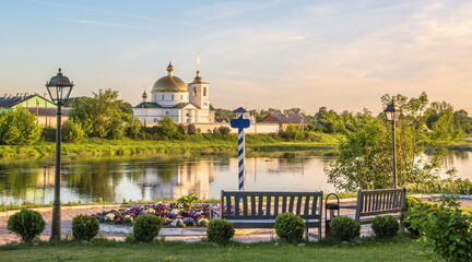 Fototapeta na wymiar Embankment of the Velikaya River in the ancient Russian town of Ostrov