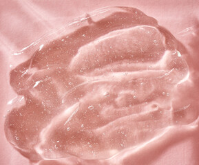 Aloe vera gel on pink background. Natural skin moisturizer.