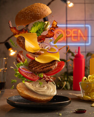 Burger with flying ingredients. Burger levitation (flying burger).
