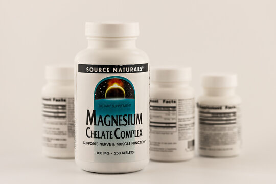 magnesium chelate complex pills in the jar. dietary supplement editorial photo