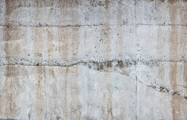 Concrete sunny wall with drips
