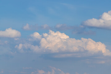 Fototapeta na wymiar Blue sky with white clouds in sunny weather.