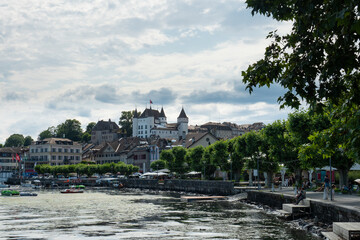 Fototapeta na wymiar Nyon, Switzerland - July 10th 2021: View of the waterfront of the city at Lac Leman