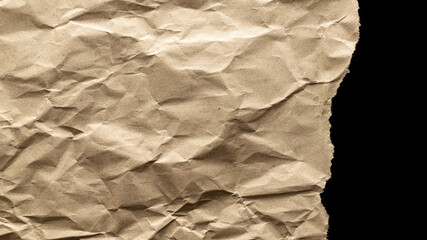 Obraz premium Ripped craft paper. Torn kraft paper texture background. Old craft vintage cardboard isolated on black with clipping path.