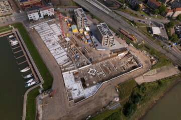 Outline aerial top down blueprint view of luxury apartment complex construction site at riverbank of river IJssel. New urban housing Kade Zuid project in Noorderhaven residential neighbourhood