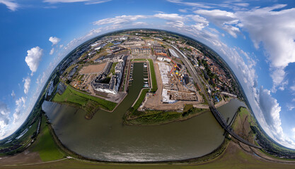 360 degrees view of construction site Kade Zuid part of the new Noorderhaven neighbourhood at river IJssel in Zutphen ready for VR. Aerial industrial of building plot. Housing and urban management.