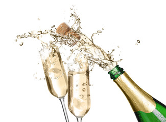 Sparkling wine splashing out of bottle and glasses on white background