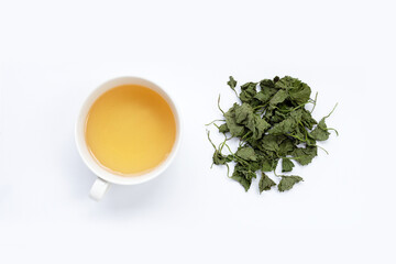 Obraz na płótnie Canvas Cup of tea with gotu kola dried leaves on white background.