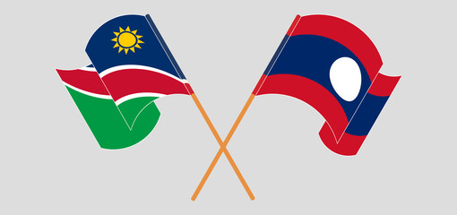 Crossed and waving flags of Namibia and Laos