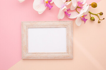 Frame on pink background with orchid with place for text