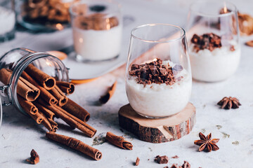 Rice pudding with cinnamon and anis decorated in holiday mood