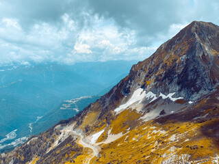 Yellow emerald mountains. Top view. A blue haze in the distance. Artistic photo processing