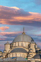 Fototapeta na wymiar Turkey Istanbul Eminem the roof top of the new mosque at sunset . One of the most touristic visited places in Istanbul.
