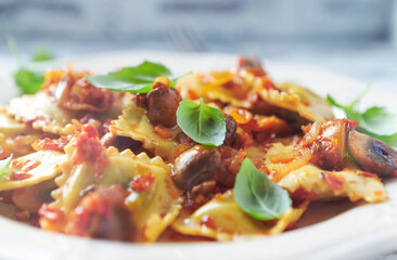 Ravioli with mushrooms and fresh basil. Close up. 