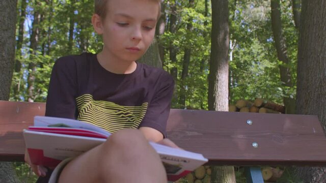 The boy touches the inner corner of his eye with his finger. Obsessive-compulsive movement syndrome in children.