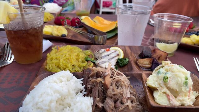 plate of food at Hawaiian Luau shredded pork on dinner table in Hawaii