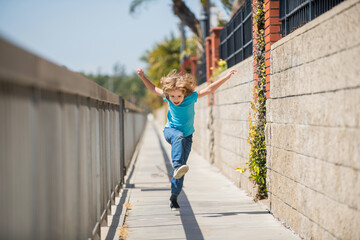 When living an active life be happy and energetic. Energetic kid run on promenade. Fun childhood