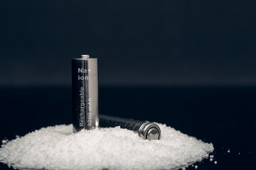two rechargeable sodium ion batteries on a bunch of salt - obrazy, fototapety, plakaty