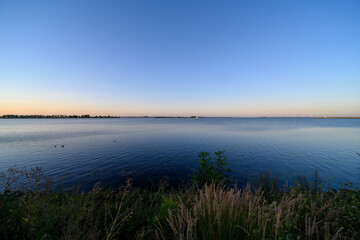Fototapeta na wymiar The IJburgbaai bay on a summer evening