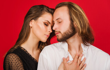 Portrait of stylish couple. Love. Sensuality. Beautiful young woman and man closeup.