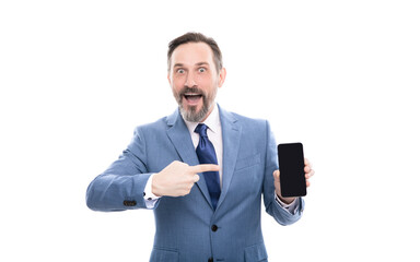 surprised grizzled boss presenting modern mobile phone isolated on white copy space, promotion.