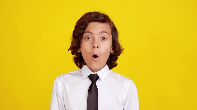 Crazy speechless schoolboy look camera open mouth