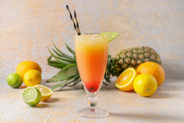 Glass of tasty summer cocktail on grunge background