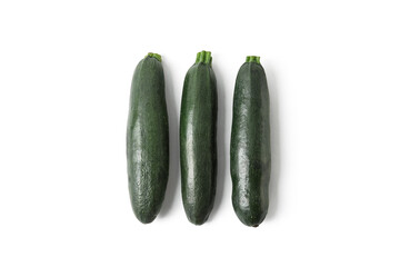 Fresh zucchini squashes on white background