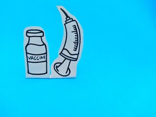 Vaccines and Syringes paper cut isolated on blue background