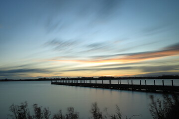 Sunrise by a pier.