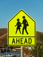 Close up view of school crossing ahead sign