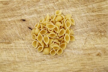 Italian raw pasta conchiglie rigate macaroni shells Traditional food.