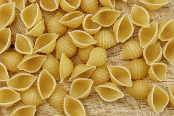 Italian raw pasta conchiglie rigate macaroni shells Traditional food.