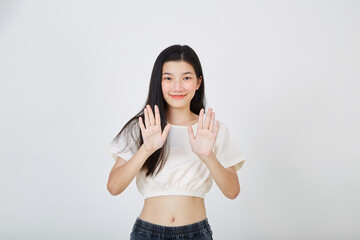 Young woman showing stop with two hands