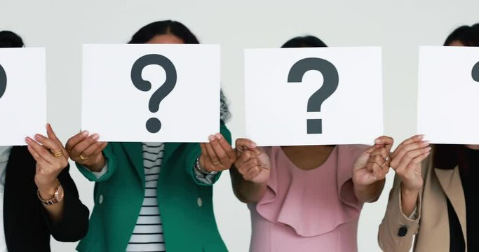 Group in row of businesspeople in business clothes hold paper with question mark signs in symbol of asking and need for answers. Concept of losing patience and show problems in working or job.