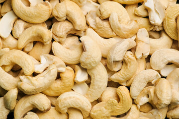 Top view raw cashew nuts rotation, close up.