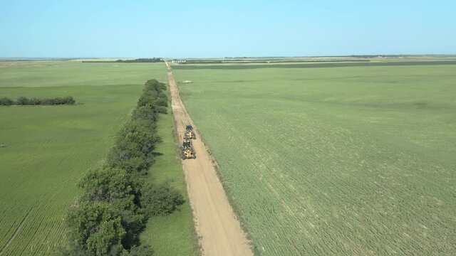 Aerial View Of Road Graders At The Rough Road In Canadian Province Of Saskatchewan.